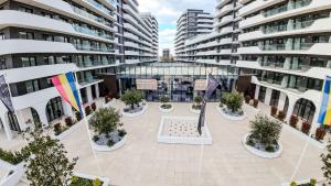 an empty courtyard in the middle of a building at Unique 4U Apartment in Odyssey Spa&Pool-parking in Mamaia