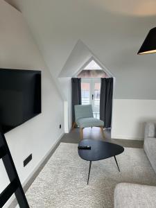 TV a/nebo společenská místnost v ubytování Business Accommodation 'Loft' Intimate
