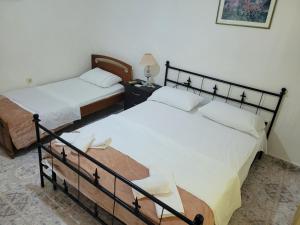 Postel nebo postele na pokoji v ubytování Guesthouse Reçka