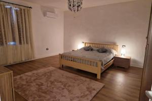 a bedroom with a bed with two pillows on it at San Miniato 2-Bed Villa Sleeps 6 with Parking in San Romano