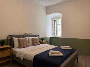 Posteľ alebo postele v izbe v ubytovaní Nest Ozana