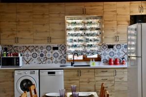a kitchen with a sink and a dishwasher at Ihtiyarsöğüt in Marmaris