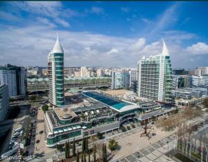 a view of a city with tall buildings and a pool at Perfect Room Near Airport 2 in Lisbon
