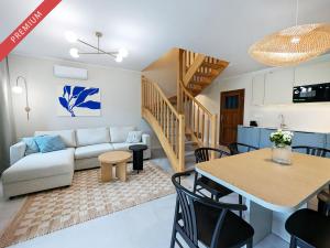 a living room with a couch and a table at Nautilus-Rowy in Rowy