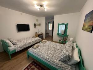 Postel nebo postele na pokoji v ubytování Kruna Palića