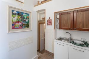 Kuchyň nebo kuchyňský kout v ubytování Bilocale Torre dellOrologio - Salento Reservation + 6 fotografií
