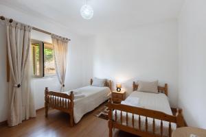 En eller flere senge i et værelse på Sousa's House - Alojamento Local