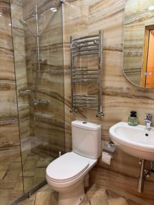 a bathroom with a toilet and a sink at Agora Sundeck Tsikhisdziri in Ts'ikhisdziri +52 photos