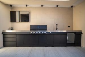 a kitchen with a sink and a counter top at Vacation House Privlaka in Privlaka