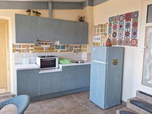 Kuchyňa alebo kuchynka v ubytovaní Iakinthi Apartment