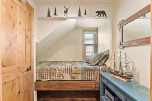 a bedroom with a bed and a mirror at TahoeCozy with Pool Hot Tub and Near Northstar in Tahoe Vista