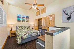 a bedroom with a bed and a ceiling fan at TahoeCozy with Pool Hot Tub and Near Northstar in Tahoe Vista
