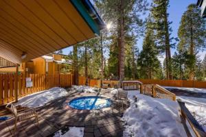 a patio with a swimming pool in the snow at TahoeCozy with Pool Hot Tub and Near Northstar in Tahoe Vista