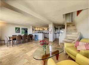 a living room with a couch and a table at Charming Villa with stunning sea views in Mougins