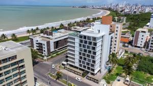 an aerial view of a city and the beach at Neo Duos #505 - Intermares por Carpediem in Ilha da Restinga