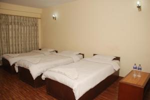 Postel nebo postele na pokoji v ubytování Kathmandu Madhuban Guest House