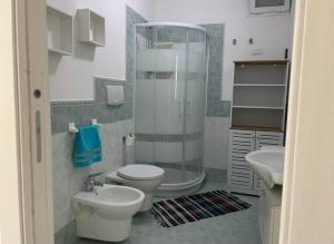 a bathroom with a shower and a toilet and a sink at case vacanza hoya in Lacco Ameno +15 photos
