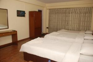 Postel nebo postele na pokoji v ubytování Kathmandu Madhuban Guest House