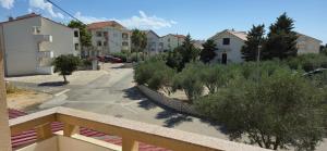 a view of a street with houses and trees at Apartments NOVALJA, Burin Bok 5 in Novalja