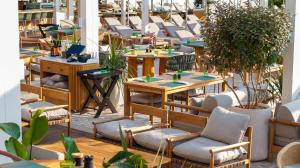 a row of tables and chairs in a restaurant at Rixos Premium Dubrovnik in Dubrovnik