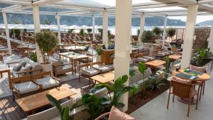 an overhead view of a restaurant with tables and chairs at Rixos Premium Dubrovnik in Dubrovnik