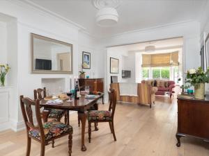 a dining room and living room with a table and chairs at 2 Bed in Windermere SZ306 in Windermere