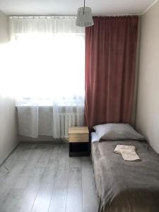 Ένα ή περισσότερα κρεβάτια σε δωμάτιο στο UrbanWave