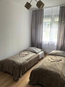 Ένα ή περισσότερα κρεβάτια σε δωμάτιο στο UrbanWave