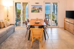 a living room with a table and chairs and a couch at Panoramic Apartment SoleLago in Pai