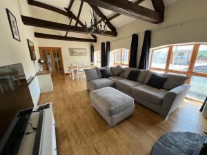 a living room with a couch and a table at The Annexe in Ammanford