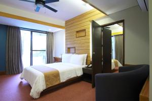 Postel nebo postele na pokoji v ubytování Grand Sierra Pines Baguio