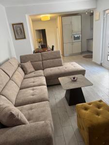 a living room with a couch and a coffee table at Apartman Ana in Neum