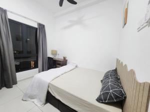 Postel nebo postele na pokoji v ubytování Ipoh town horizon 3br 6pax