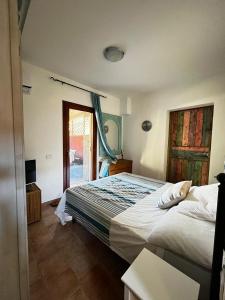 Ένα ή περισσότερα κρεβάτια σε δωμάτιο στο Relax in Olbia Apartment with Private Garden 2 Bedrooms