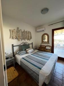 Ένα ή περισσότερα κρεβάτια σε δωμάτιο στο Relax in Olbia Apartment with Private Garden 2 Bedrooms