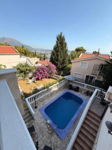 a swimming pool in a yard next to a house at Imperia in Bar