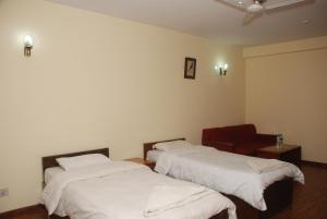 Postel nebo postele na pokoji v ubytování Kathmandu Madhuban Guest House