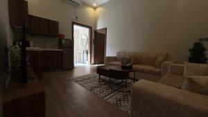 a living room with a couch and a table at نزل سكون in Al Baha +6 photos