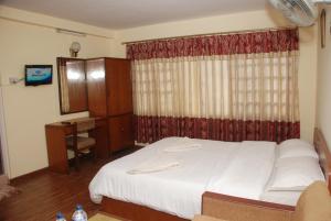 Postel nebo postele na pokoji v ubytování Kathmandu Madhuban Guest House
