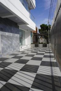 a black and white checkered floor on a building at Hotel Gama Cartagena in Cartagena de Indias