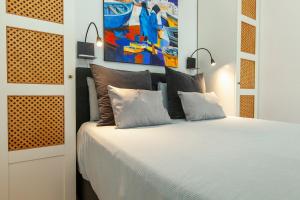 Ένα ή περισσότερα κρεβάτια σε δωμάτιο στο Casa Souira Olhão by Enjoy your stay