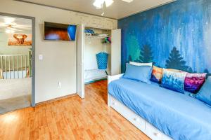 a bedroom with a bed with blue pillows on it at Family Retreat 2 Mi to Santas House Pets Welcome in North Pole