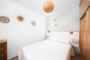 En eller flere senge i et værelse på Apartamento en 1a Línea de playa Beachfront apartment