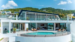 an image of a house with a swimming pool at Villa La Concha - Ideal for Families in Ban Khlong Mae Nam