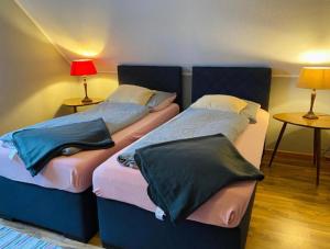 Postel nebo postele na pokoji v ubytování Lily-Rose Cottage