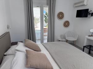 Postel nebo postele na pokoji v ubytování Kastraki Dunes Naxos