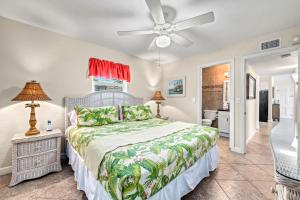 a bedroom with a bed and a ceiling fan at Tidal Wave - In Siesta Key Village, Pet Friendly, Private Pool! in Siesta Key +61 photos