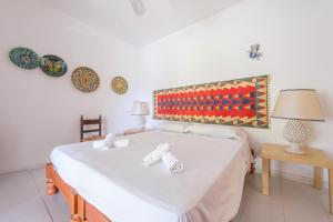 a bedroom with a bed and a table with a lamp at Villa Anna Maria in Vulcano