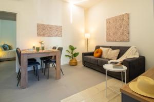 a living room with a couch and a table at La Corte - Monza Apartments in Monza +20 photos