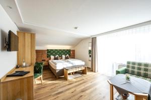 Ένα ή περισσότερα κρεβάτια σε δωμάτιο στο Hotel Garni Schellenberg